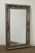 Rectangular bevel edged mirror in silvered swept framed,