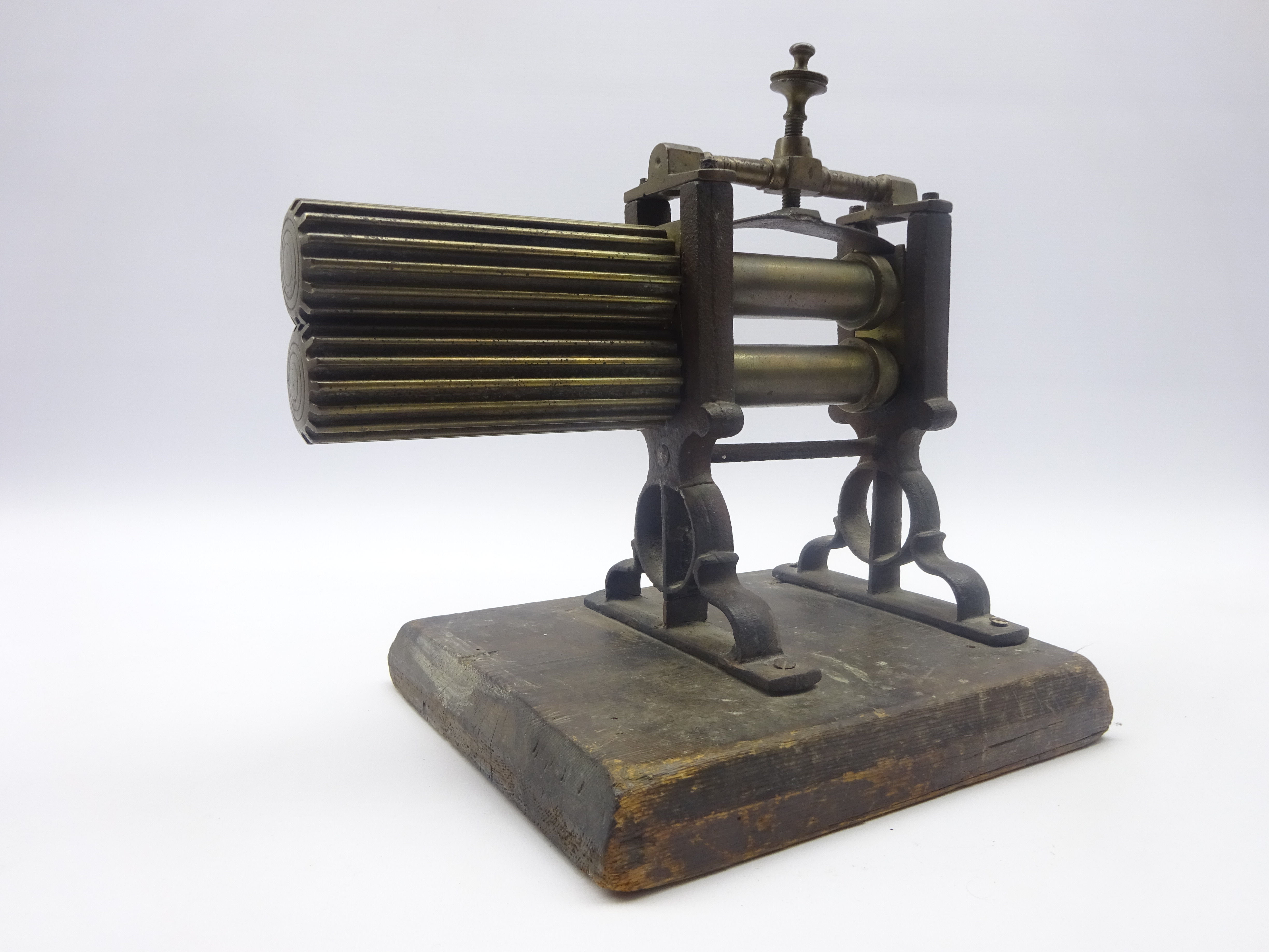 19th century brass and iron Fluting Iron with ebony turned handle, mounted on pine base, - Image 2 of 2