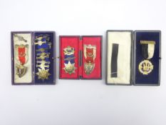 Four early 20th century Knights of the Golden Horn jewels, three hallmarked silver, awarded to Kt.W.