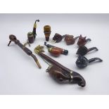 Nine novelty smoking pipes, predominantly continental, including animal head and hedgehog briars,