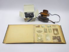 Victorian album containing laid-in photographs and postcards of various sizes depicting family life,