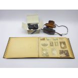 Victorian album containing laid-in photographs and postcards of various sizes depicting family life,