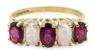 9ct gold five stone opal and garnet ring,