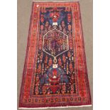 Persian Kolya rug, blue ground field decorated with stylised motifs,