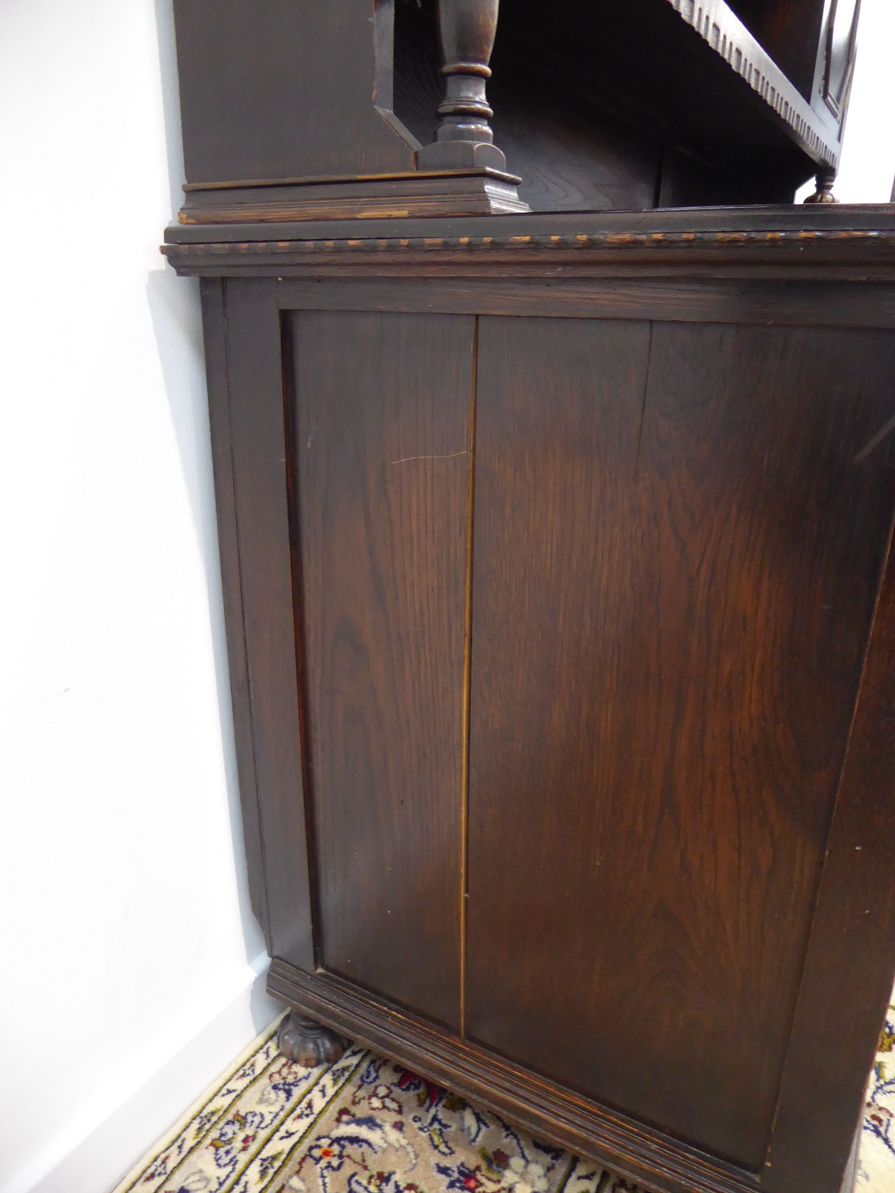Early 20th century oak dresser, projecting cornice above two geometric cupboards and centre shelves, - Image 2 of 2