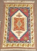 Turkish beige ground rug, lozenge field with stylised floral decoration (190cm x 130cm),