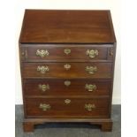 Edwardian mahogany bureau, sloped fall front enclosing fitted interior, four graduating drawers,