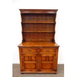 Medium oak dresser, two heights plate rack above two drawers and two panelled doors, by 'S.