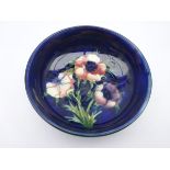 Moorcroft footed bowl decorated in the Anemone pattern, impressed Potter to H.