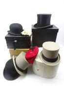 Collection of hats including Moss Bros grey top hat, boxed, two Bowler hats,