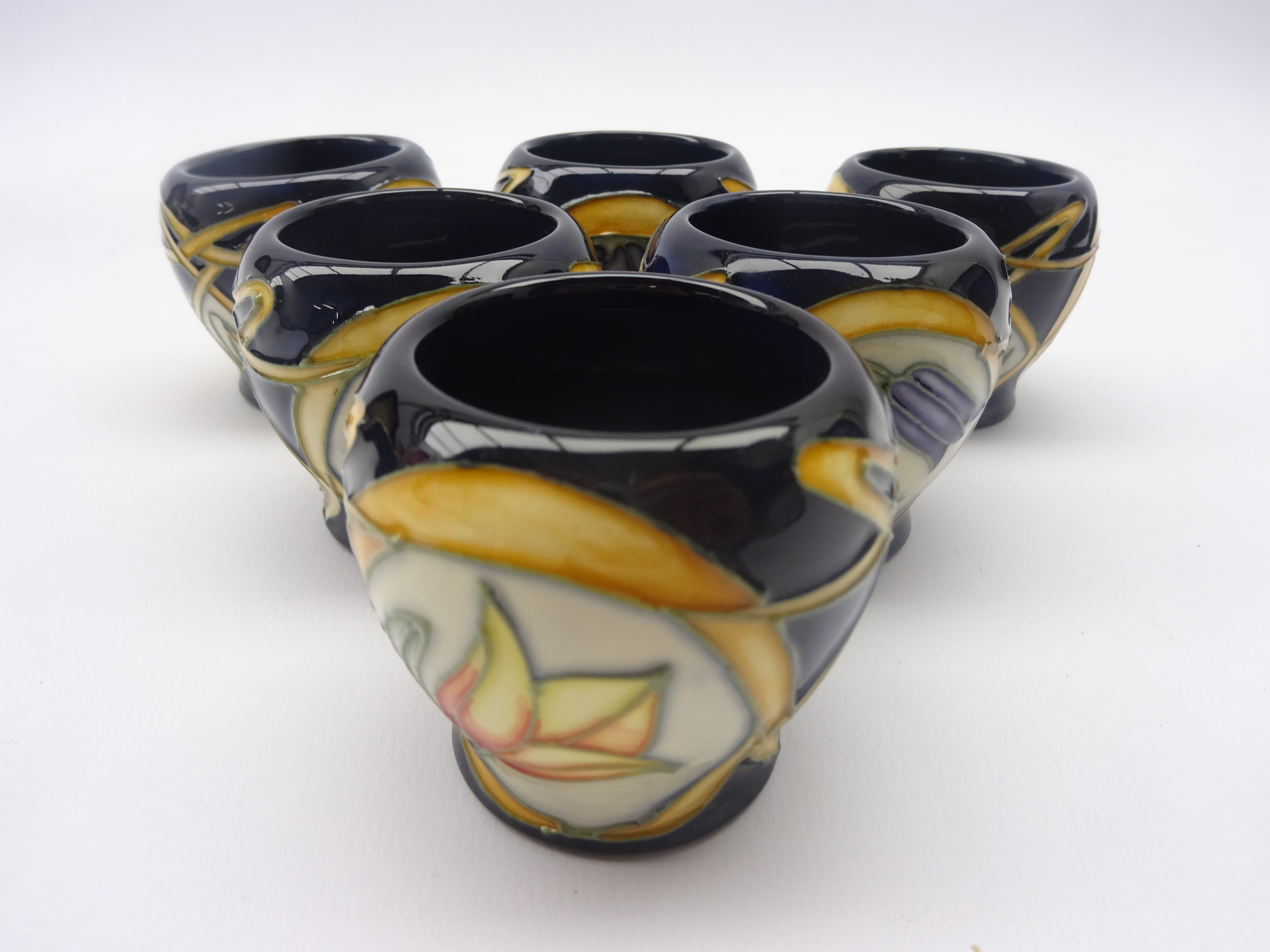 Set of Six Moorcroft egg cups painted with flowers in the 'Parisian Dream' pattern after Sian