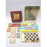 1920's wooden jigsaw depicting a Galle style cat, quantity of card games including Disney,