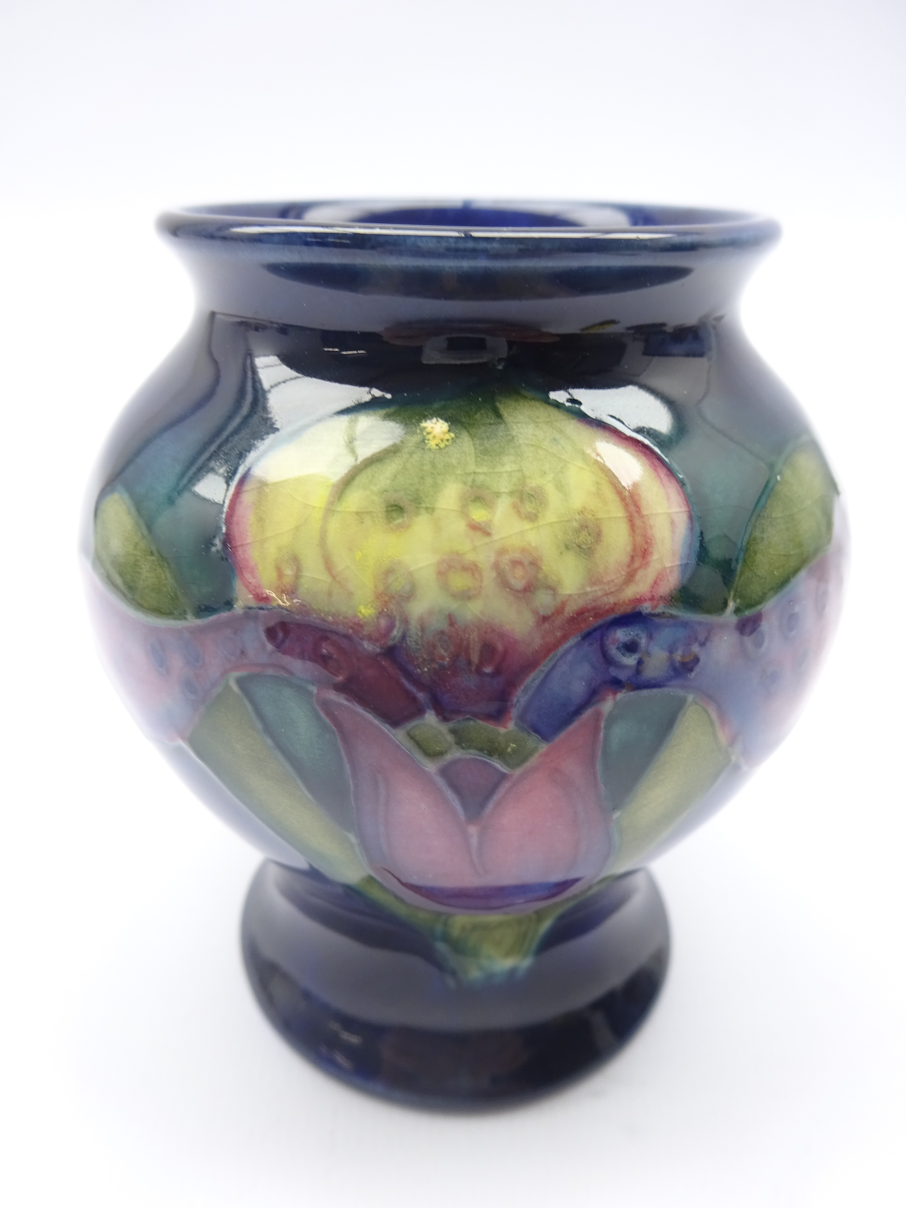 Small Moorcroft Orchid pattern vase, impressed marks, H8.