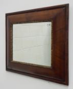 18th century figured walnut cushion framed mirror,