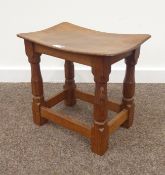 'Mouseman' oak stretcher stool, adzed dished top, four octagonal carved supports with signature,