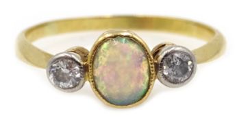 Gold three stone opal and diamond ring, Condition Report & Further Details Approx 1.