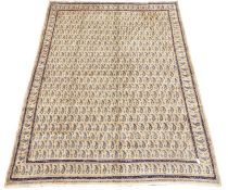 Large Persian Mood beige ground carpet, decorated with repeating Boteh motifs,