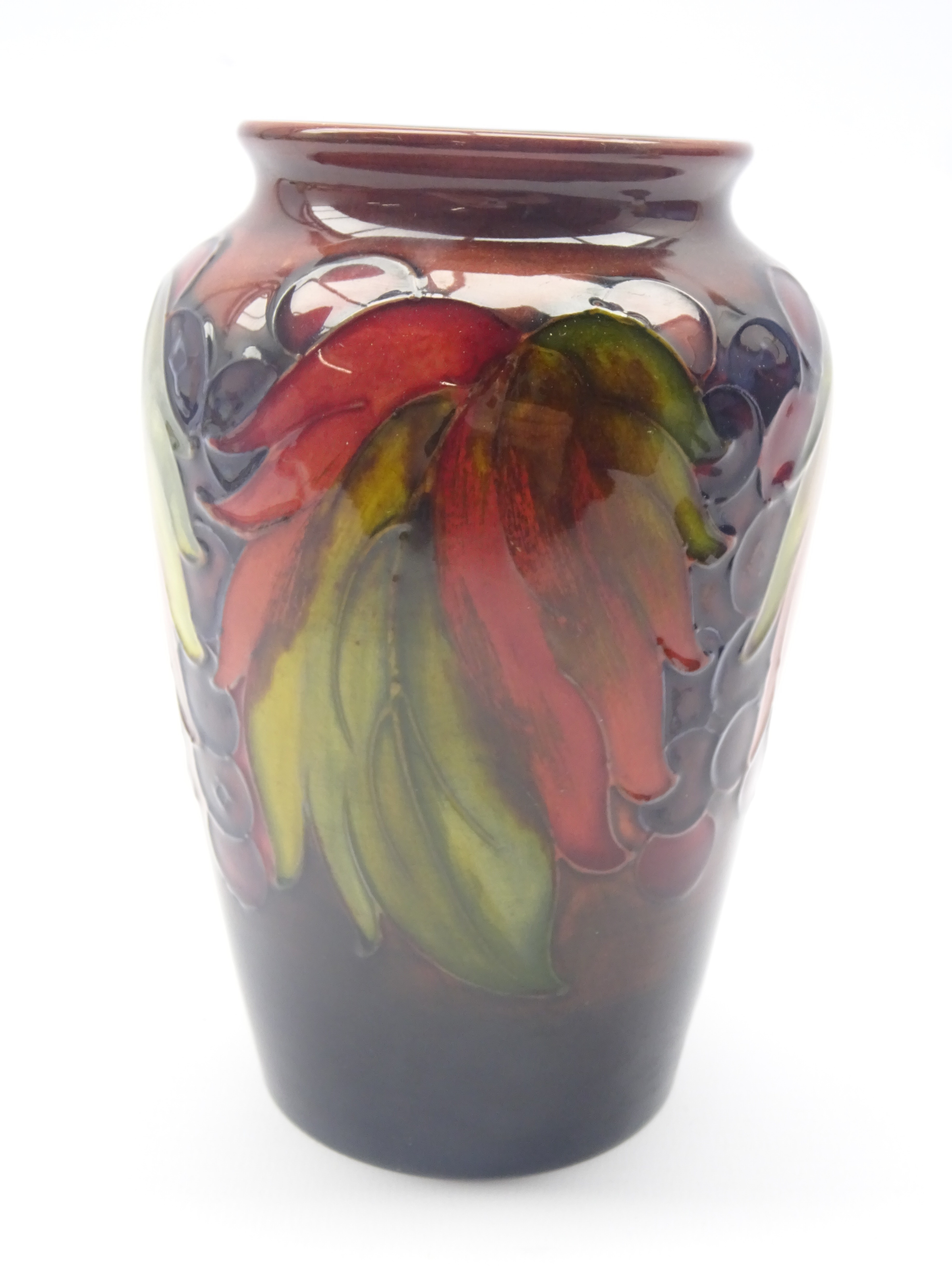 Moorcroft Flambe Leaf & Berry vase c1930 of tapered ovoid form, impressed marks, 'Potter to H.