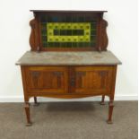 Late 19th/early 20th century oak Art Nouveau wash stand, raised splash back with green floral tiles,
