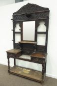 Large late Victorian heavily carved oak hall stand, scrolled acanthus leaf decoration,