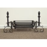 Wrought metal fire basket, scroll work fire dogs with finial tops,