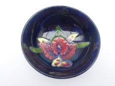 Moorcroft footed bowl decorated in the Orchid pattern, impressed marks,