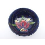 Moorcroft footed bowl decorated in the Orchid pattern, impressed marks,