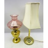 Early 20th century cast brass table lamp and shade, the cast iron base labelled Emeralite,