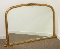 Gilt arched top overmantel mirror with bevelled glass plate,