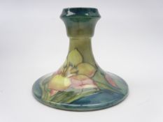 Moorcroft dwarf candlestick decorated in the Freesia pattern,