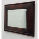 Early 18th century figured walnut cushion framed mirror, rectangular form with later plate,