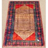 Persian Kolya rug, abrash pale ground lozenge on red field,