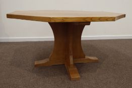 'Mouseman' oak dining table, octagonal adzed top, cruciform base on sledge feet,