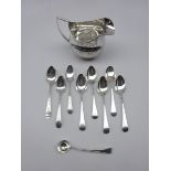 George III silver milk jug with engraved decoration by John Muns, set of six teaspoons,