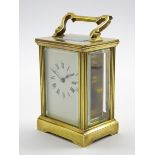 Early 20th century brass and bevel glazed carriage clock time-piece,