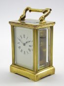 Early 20th century brass and bevel glazed carriage clock time-piece,