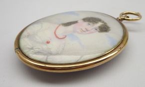 Miniature oval portrait of a young Regency lady in a white dress with a coral brooch and necklace