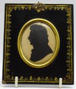 Early 19th Century oval silhouette of a gentleman in gilt decorated papier mache frame 7 x 6cms