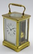 Early 20th century striking carriage clock, brass and bevelled glass case, white enamel Roman dial,