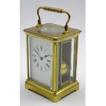 Early 20th century striking carriage clock, brass and bevelled glass case, white enamel Roman dial,