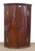 George III mahogany bow front corner cupboard,