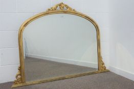Gilt framed arch top overmantel mirror, bevelled glass plate,