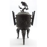 Late 19th Century Japanese bronze vase and cover, the lift formed as a bird on a branch,