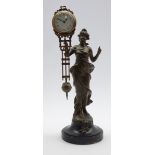 Early 20th century spelter figural mystery clock, circular Arabic dial above pendulum,