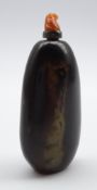 Chinese red and black agate snuff bottle of tapering design with carved coral mounted spoon L7cms