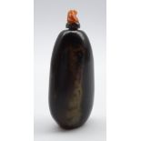 Chinese red and black agate snuff bottle of tapering design with carved coral mounted spoon L7cms