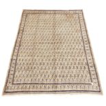 Large Persian Mood beige ground carpet, decorated with repeating Boteh motifs,