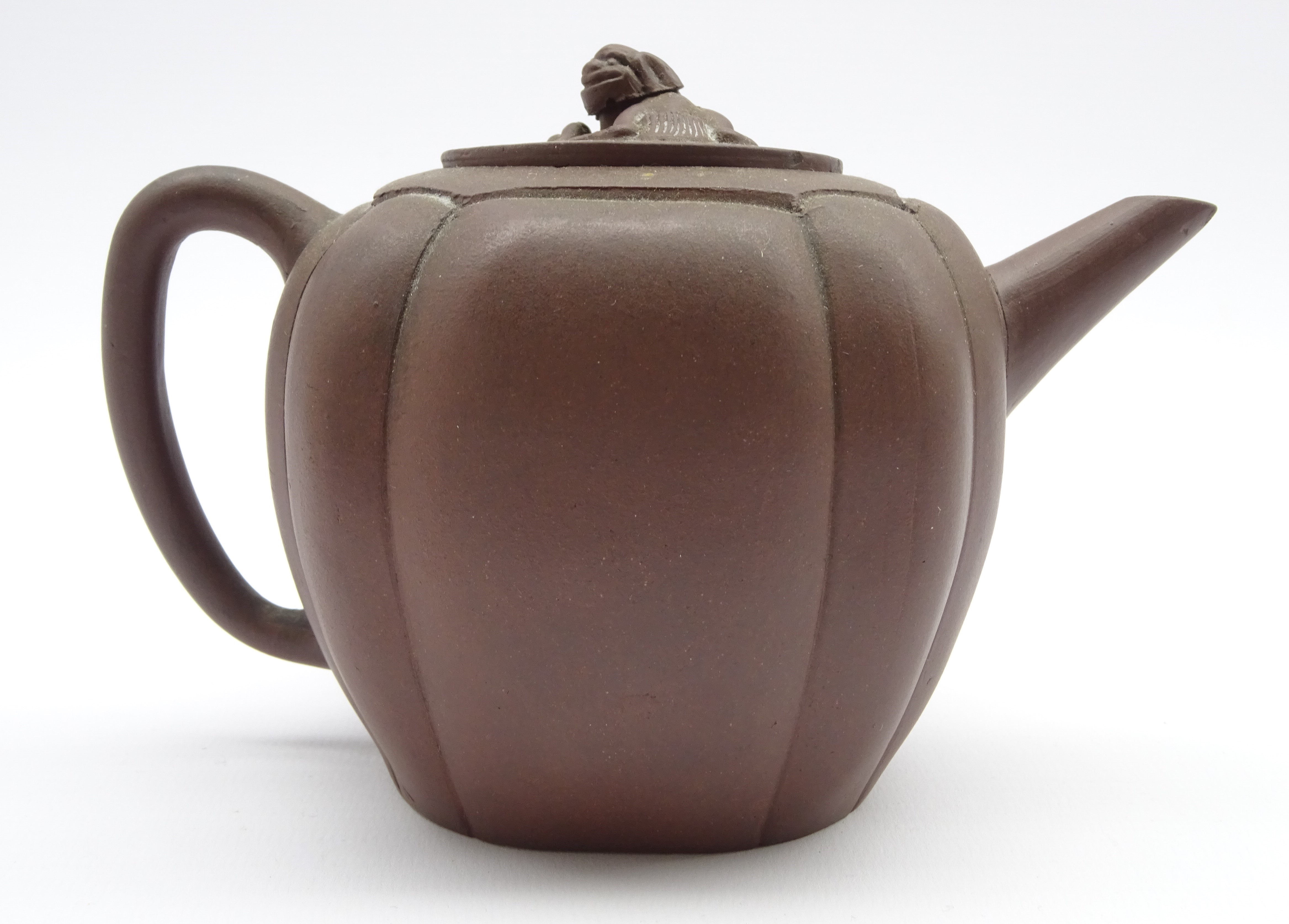 Chinese terracotta teapot of circular design with Dog of Fo lift and loop handle H11cms