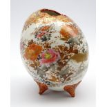 Japanese porcelain vase in form of an egg with floral shaped mouth on four butterfly shaped