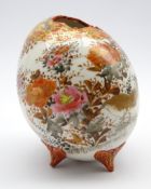 Japanese porcelain vase in form of an egg with floral shaped mouth on four butterfly shaped